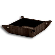 Brown 18.5 × 18.5 cm valet tray open, press studs drawing up the woven-embossed leather corners