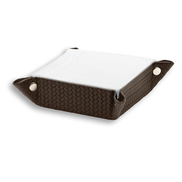 The brown 15 cm valet tray with a folded white cloth resting inside its 6 cm sides