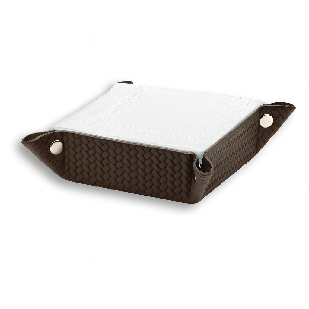 The brown 15 cm valet tray with a folded white cloth resting inside its 6 cm sides