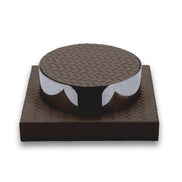 Dark brown set, the steel band scalloped away to show the coaster edges beneath the top disc