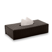 Dark brown cover seen whole, only 6 cm high with the tissue standing above the centre slot
