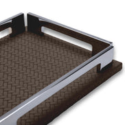 The long polished rail of the brown tray from low down, side notch visible, full-grain leather weave running away