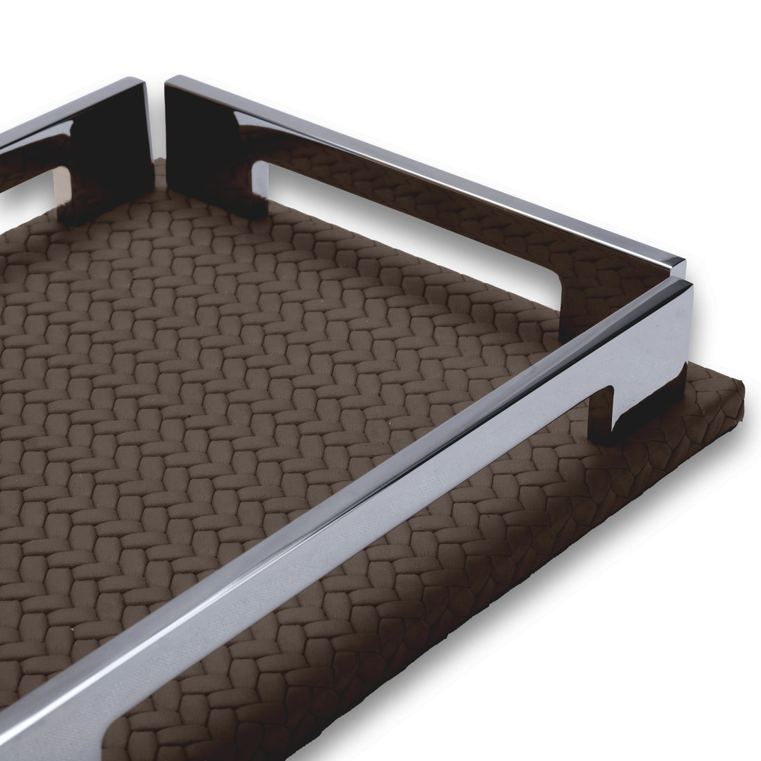 The long polished rail of the brown tray from low down, side notch visible, full-grain leather weave running away