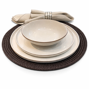 Cream plates and bowl stacked on the 36 cm brown placemat, linen napkin behind in a cord ring