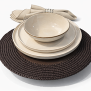 The 36 cm brown placemat laid with three cream ceramics, its cord border showing past the plate rim