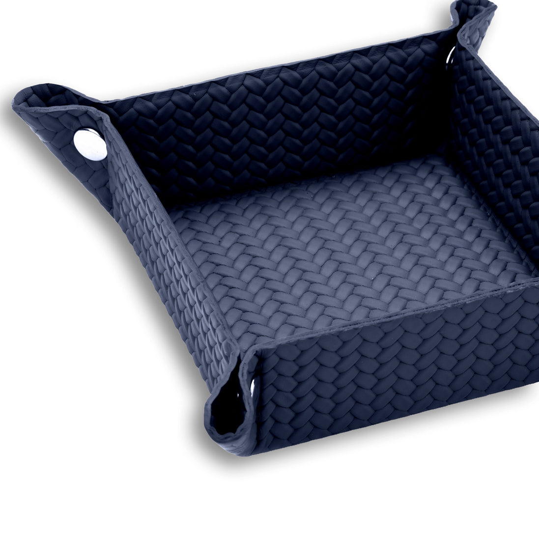 Navy valet tray at close range, woven-embossed leather running up the full 6 cm side wall