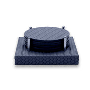 Navy Ø 10 cm leather coasters stacked between four polished steel corner rods on a square leather base