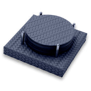 Close from above on the navy set, top coaster and the woven-embossed base framed by the steel rods