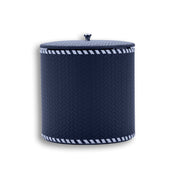 Navy woven-embossed leather, pale lacing tracing the seam where the lid meets the 17 cm body