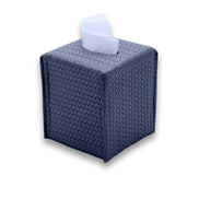 Navy 11.5 × 11.5 × 13.5 cm upright tissue cover, a tissue drawn through the opening in its woven leather top