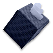 The navy 13.5 cm tissue cover tilted onto its corner, weave running over each face