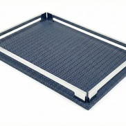 Navy blue 30 × 16 cm tray from above left, polished steel rails standing on the woven-embossed leather base