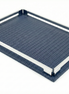 Navy blue 30 × 16 cm tray from above left, polished steel rails standing on the woven-embossed leather base
