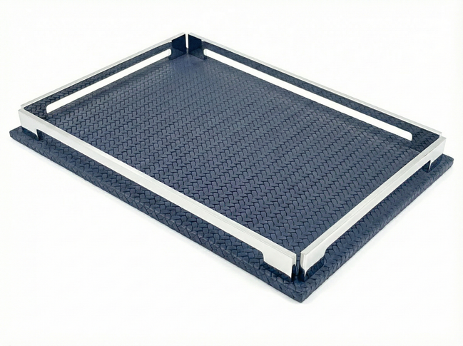 Navy blue 30 × 16 cm tray from above left, polished steel rails standing on the woven-embossed leather base