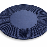 Navy round placemat at an angle, crocheted cord border ringing a 1 cm flat leather centre