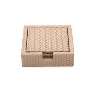 Pale sand leather coasters, the stack visible through the notch in the holder wall