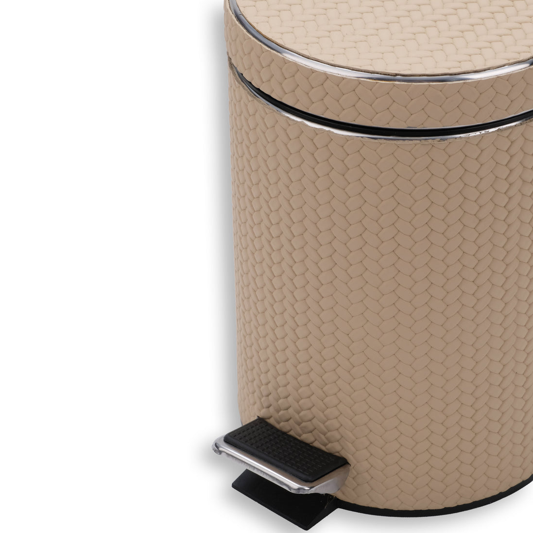 Close on the beige bin, chrome pedal and its plate in the foreground against the leather weave