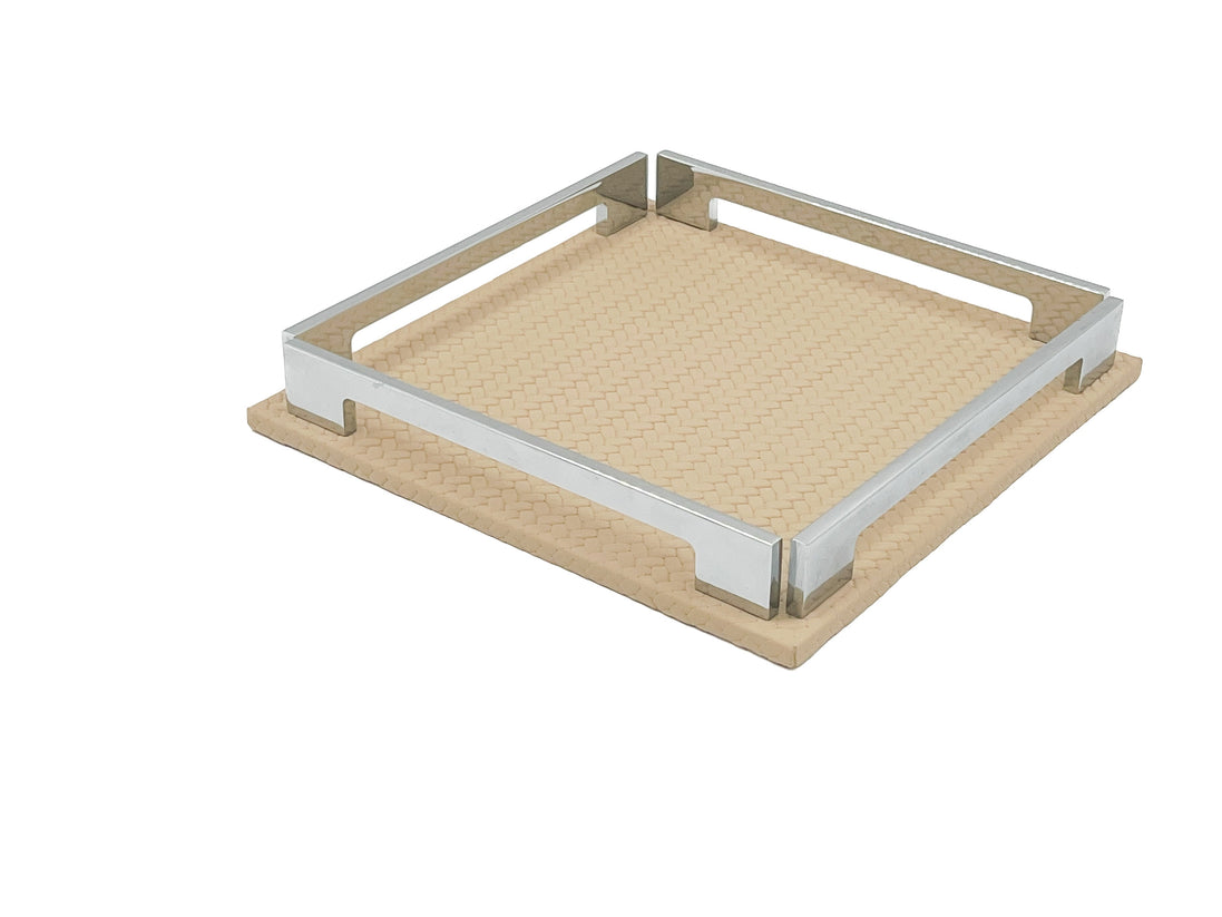 Beige 25 cm tray turned corner forward, the 1 cm leather base extending past the polished steel frame