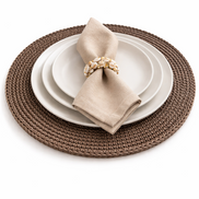 White plates and a linen napkin on the 36 cm placemat, shell ring set on the crocheted border