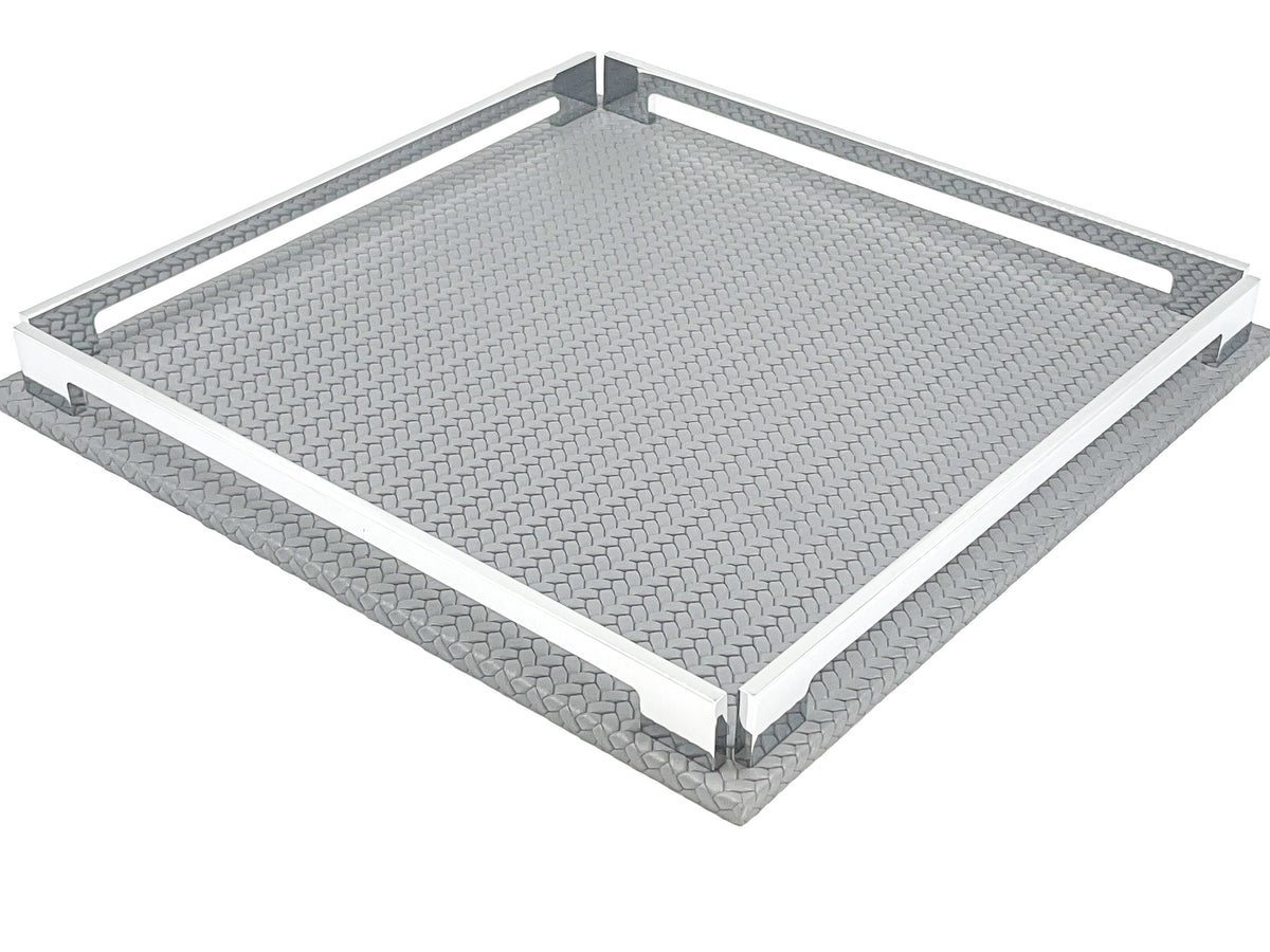 Grey 37 cm tray from above right, the 1 cm leather base visible beneath the steel rails