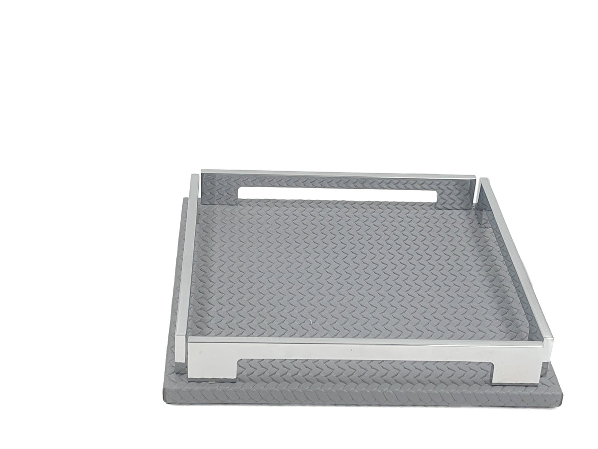 Grey 25 × 25 cm tray face on, handle slot cut through the steel rail above the leather weave
