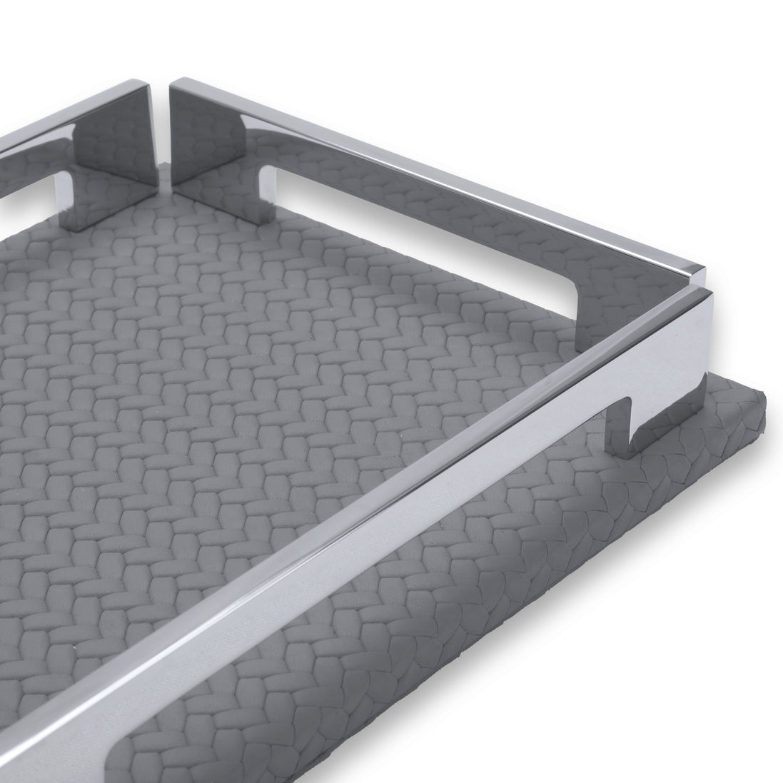 The grey tray's long rail from low down, notch cut into the leather base, weave running to the far corner