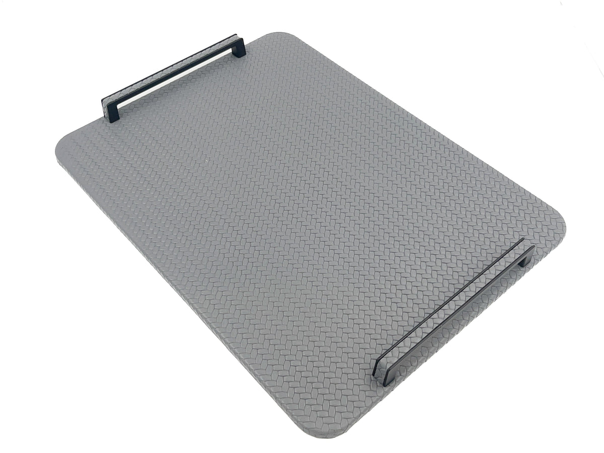 Grey 48 cm tray tilted in the frame, black steel handle at the far corner above the woven leather panel