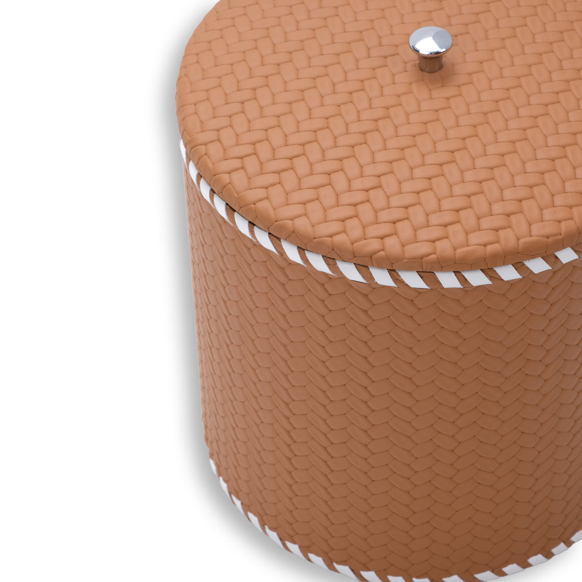 Close on the tan ice bucket's lid, steel knob and the white whip-stitched seam at full scale