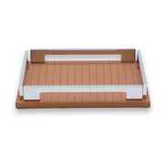 Tan 25 × 19 cm tray in full, warm leather floor framed by polished steel