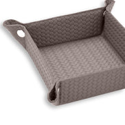 Mink grey-brown leather at close range, a corner press stud closing the 6 cm wall