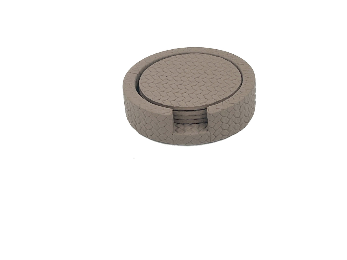 Taupe grey-brown leather holder closed, the notch and the coaster rim reading as one line