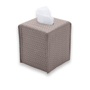 Muted grey-brown mink cover, corner seams drawing the leather tight around the 13.5 cm upright body