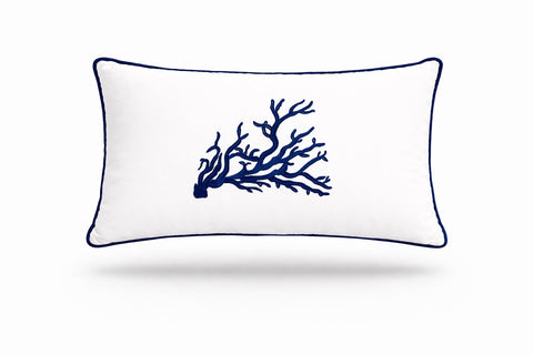Navy coral embroidered across a white 35 x 55 cm outdoor cushion trimmed in navy piping