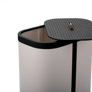 Black woven leather lid drawn aside on the 45 x 30 cm canvas hamper, wooden toggle on the panel