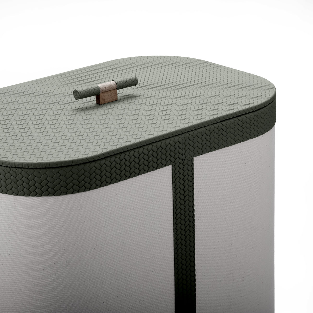 Closed olive leather lid on the 50 cm tall hamper, wooden toggle set into the woven surface