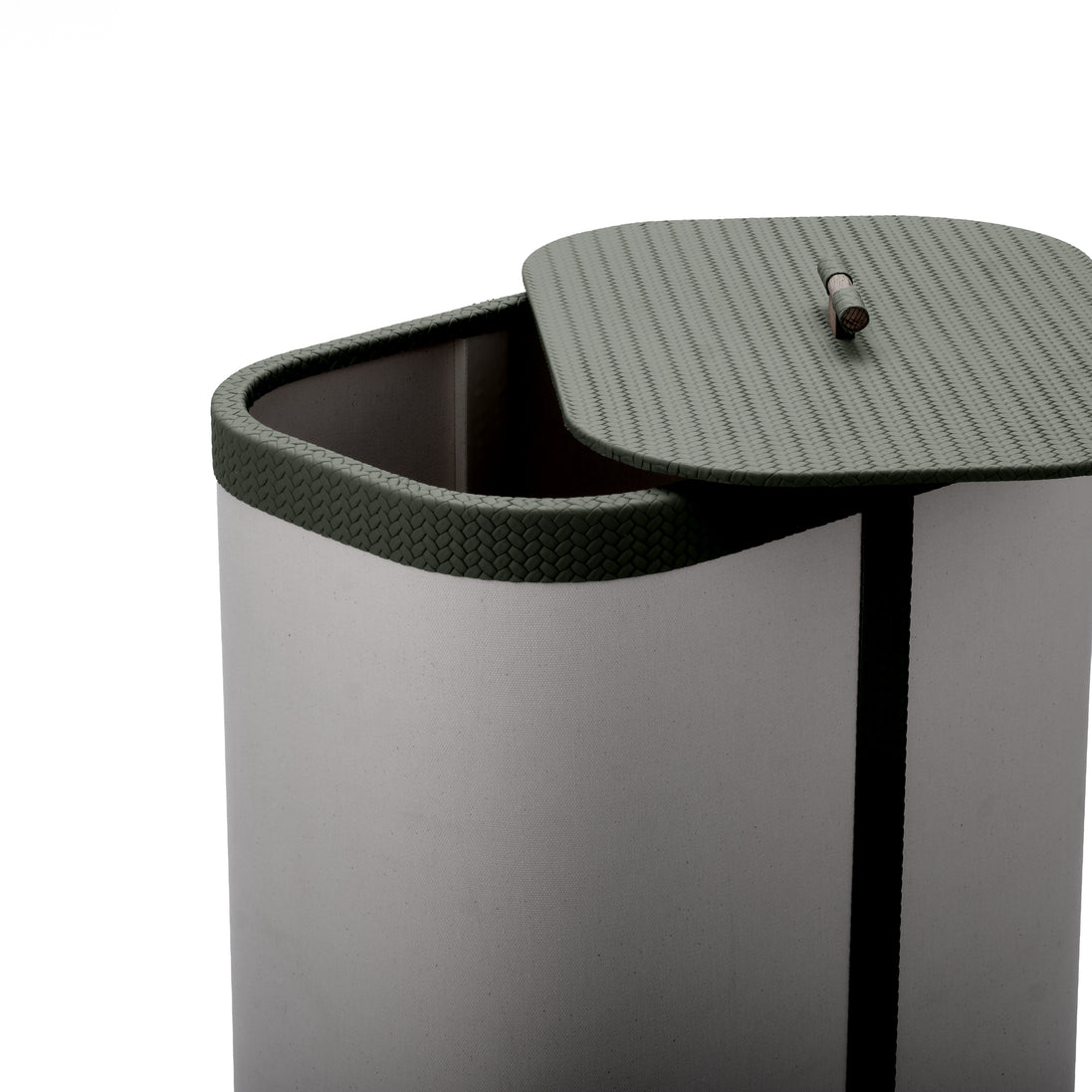 Lid slid off the 45 x 30 cm hamper, olive woven leather rim above the cream canvas body
