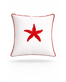 Red starfish embroidered on a white 45 x 45 cm outdoor cushion edged in red piping