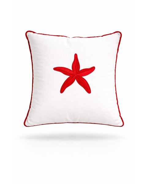 Red starfish embroidered on a white 45 x 45 cm outdoor cushion edged in red piping