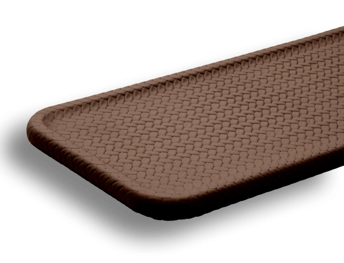 Brown slim tray at an angle, the plaited border framing the herringbone-woven leather field