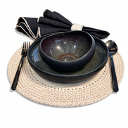 Dark glazed bowl and plate with black cutlery on the 36 cm cream placemat, napkin behind