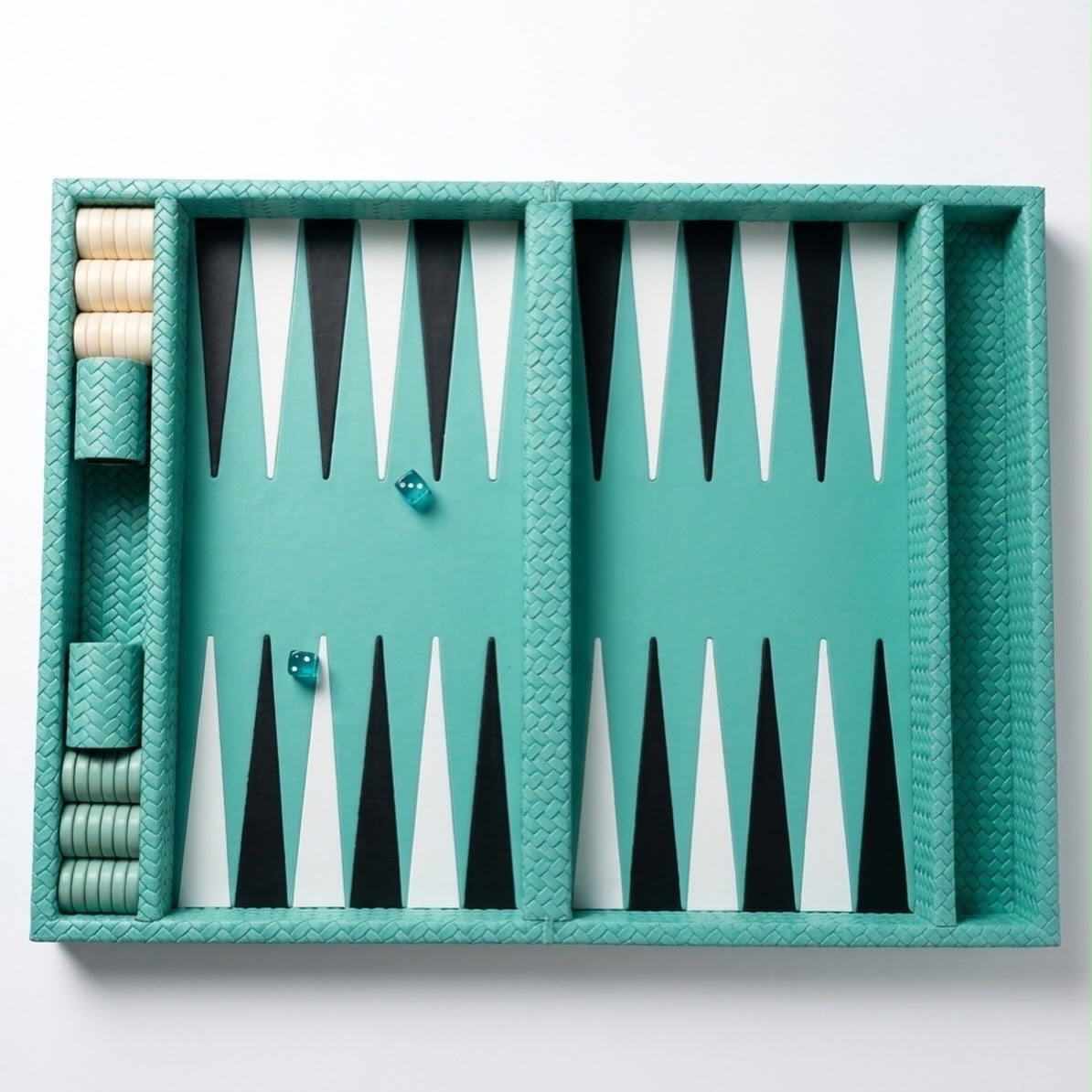 Backgammon board from directly above, checkers stacked in the side rails of the 50 × 38 cm turquoise leather case