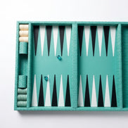 Turquoise woven leather backgammon board open flat, black and white points across the 50 cm bed