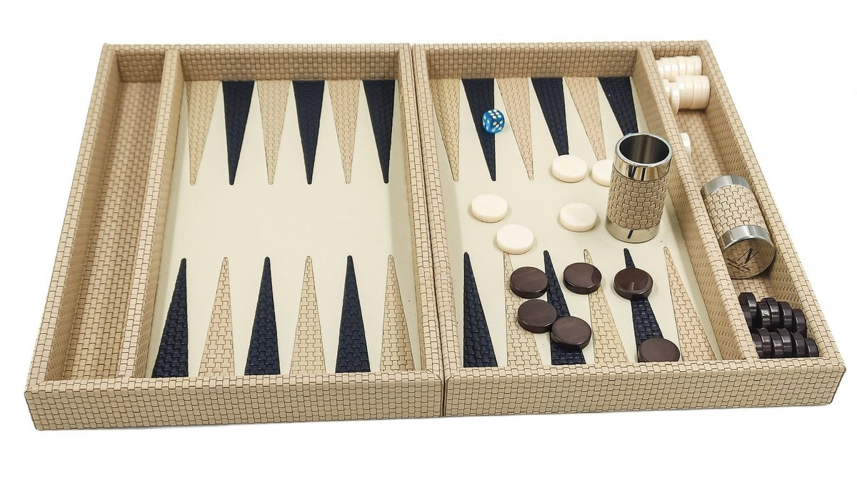 Cream leather backgammon set seen from the front, cream and dark checkers laid out beside a leather dice cup