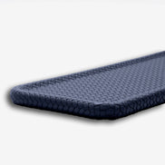 Navy blue slim tray, close on the rounded corner and the tight plaited edge that wraps it