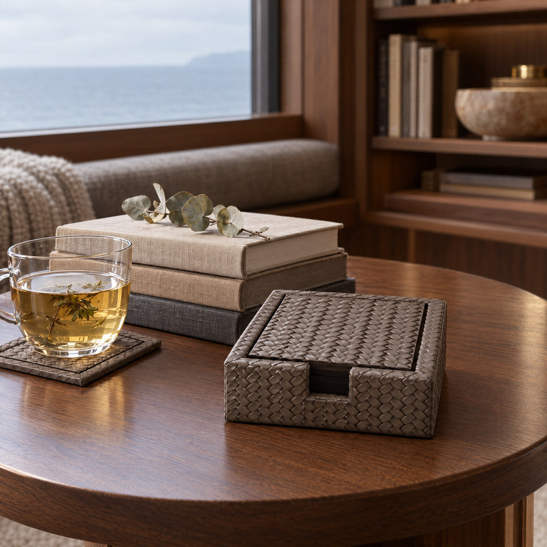 Square Woven Leather Coasters – Set of 6, 13 cm — a reading nook in the owner's suite on an overcast morning