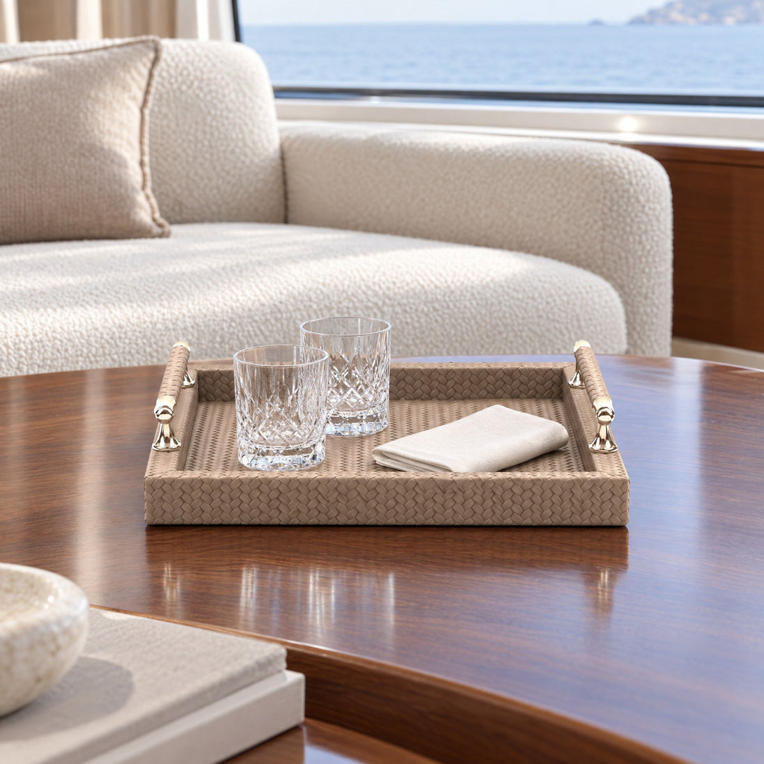 Square Woven Leather Serving Tray with Stainless Steel Handles — in a yacht setting