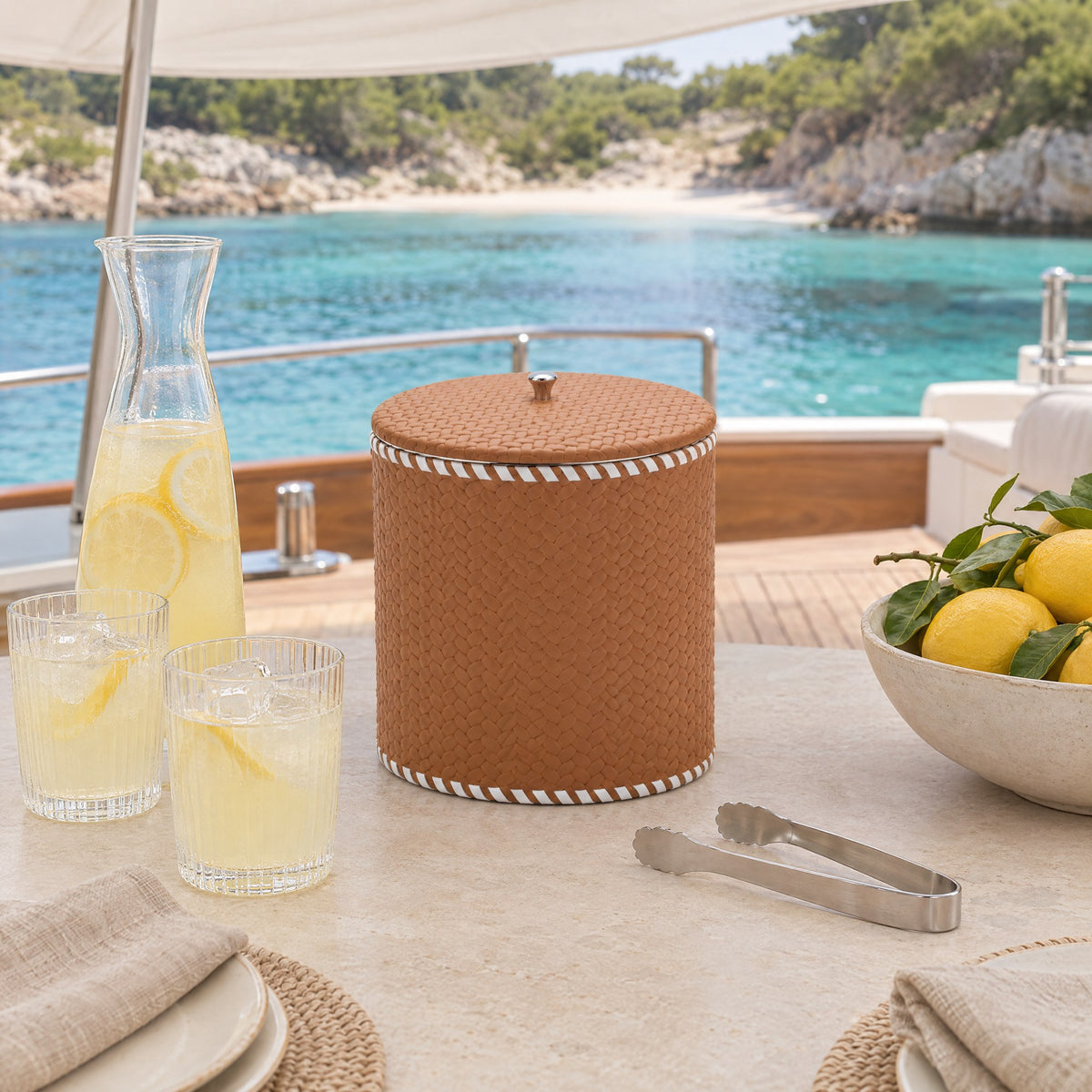 Leather-Wrapped Stainless Steel Ice Bucket – Large — a long lunch on the aft deck at midday, anchored off a quiet sandy cove