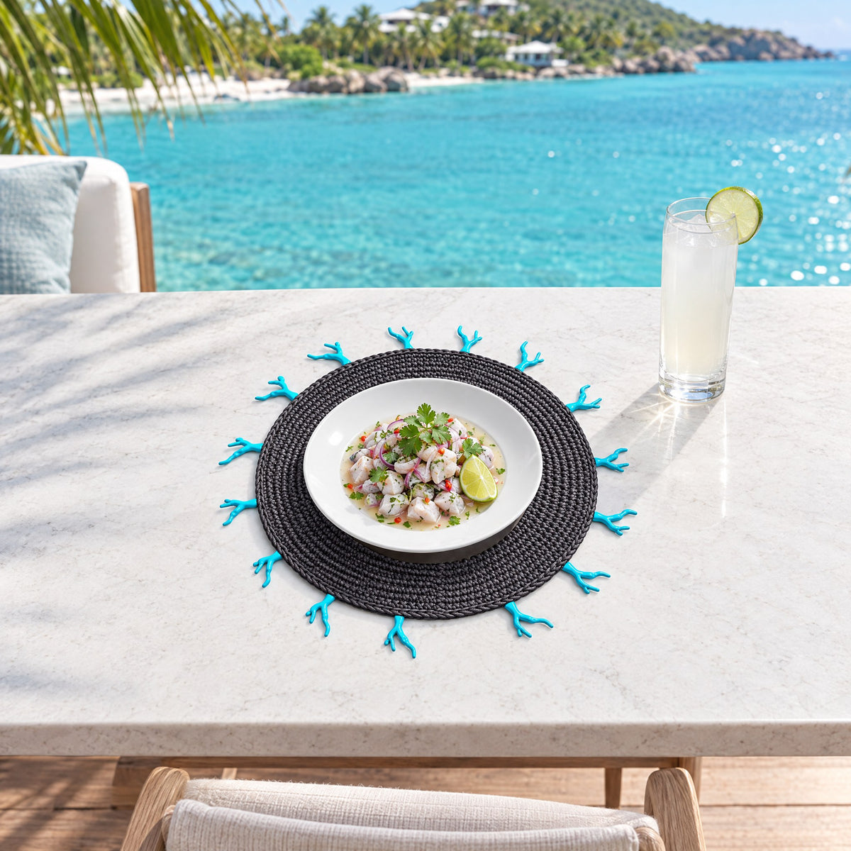 Round Woven Placemat with Turquoise Coral-Shaped Edge — anchored in a turquoise lagoon in St Barths
