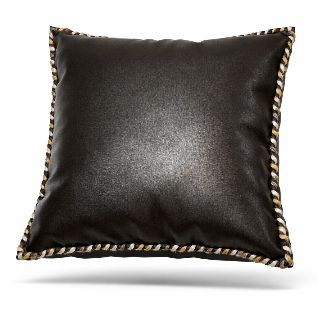 Black leather cushion with hand-braided cord in black, cream and ochre along its edge