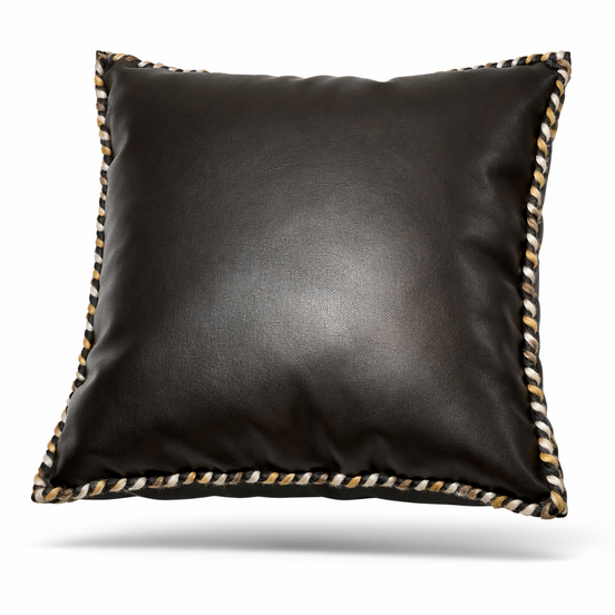 Black leather cushion with hand-braided cord in black, cream and ochre along its edge